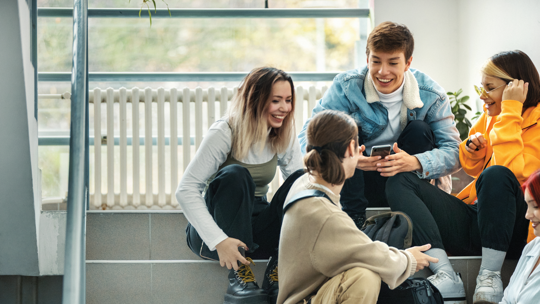 group of high school students sitting in a hallway iStock 1348756250 2560px